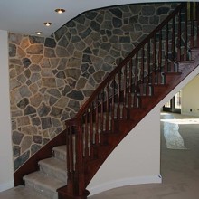 Decorative stairway trim and masonry wall